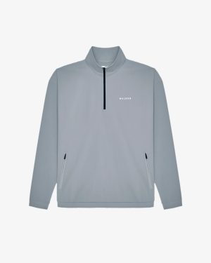 PERFORMANCE QUARTER ZIP SHELL PULLOVER